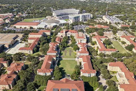 an aerial view of residential houses with outdoor space