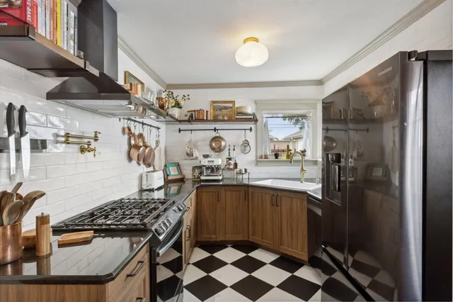 a bathroom with a granite countertop sink a toilet and shower