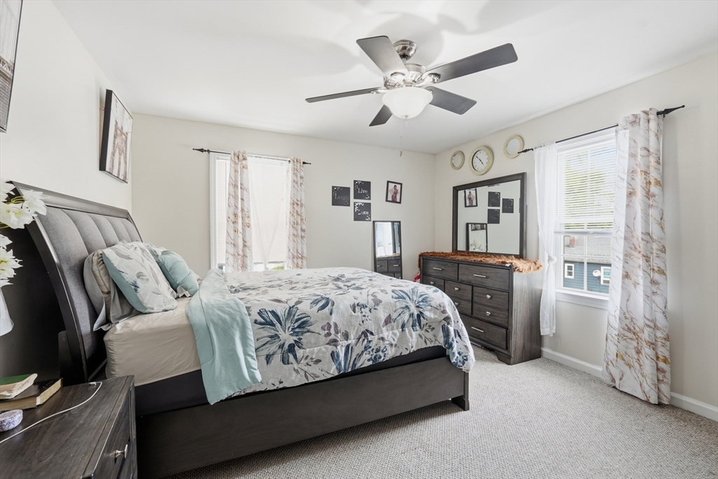 19 Annies Way Springfield, MA 01119 - Photo 20 of 40 a bedroom with a bed and a chandelier