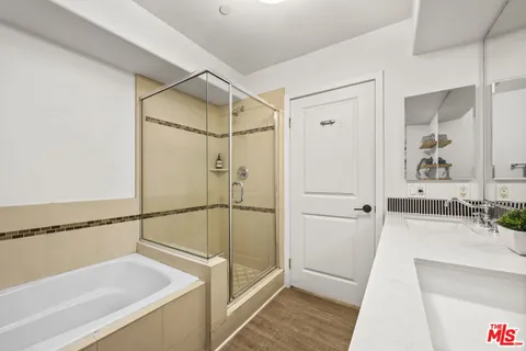 a bathroom with a tub and a sink