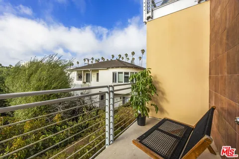 a view of a balcony with an outdoor space