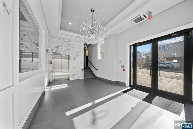 a view of an entryway with front door