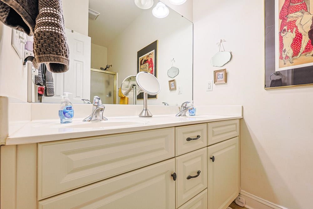815 Botany Loop, Unit 815 Murrells Inlet, SC 29576 - Photo 17 of 40 Bathroom featuring a stall shower and double vanity