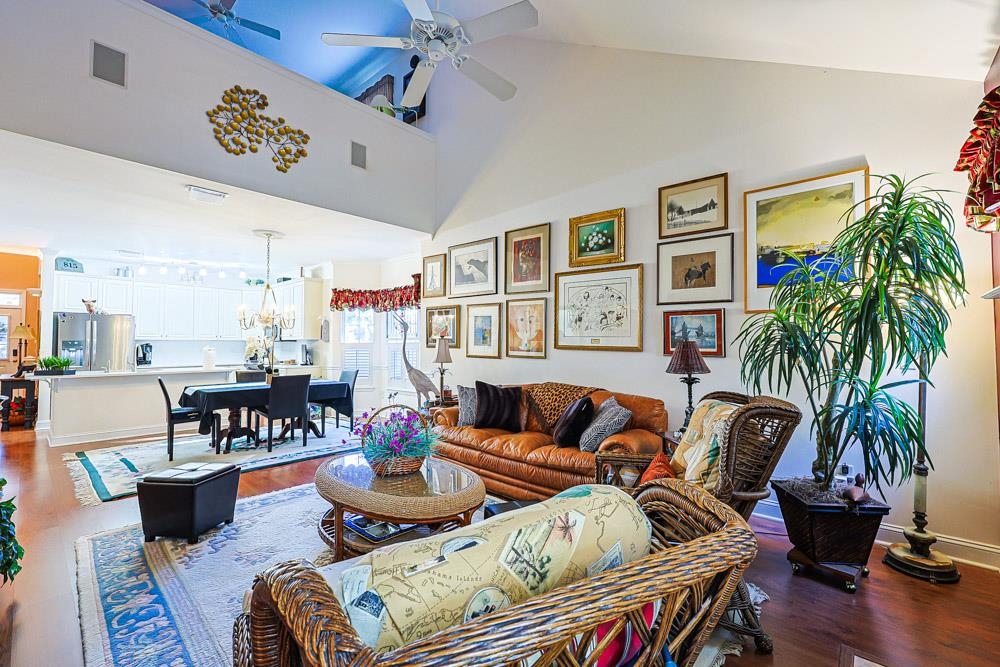 815 Botany Loop, Unit 815 Murrells Inlet, SC 29576 - Photo 2 of 40 Living area featuring wood finished floors, high vaulted ceiling, and ceiling fan
