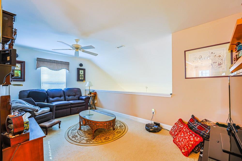 815 Botany Loop, Unit 815 Murrells Inlet, SC 29576 - Photo 22 of 40 Living area featuring carpet and ceiling fan