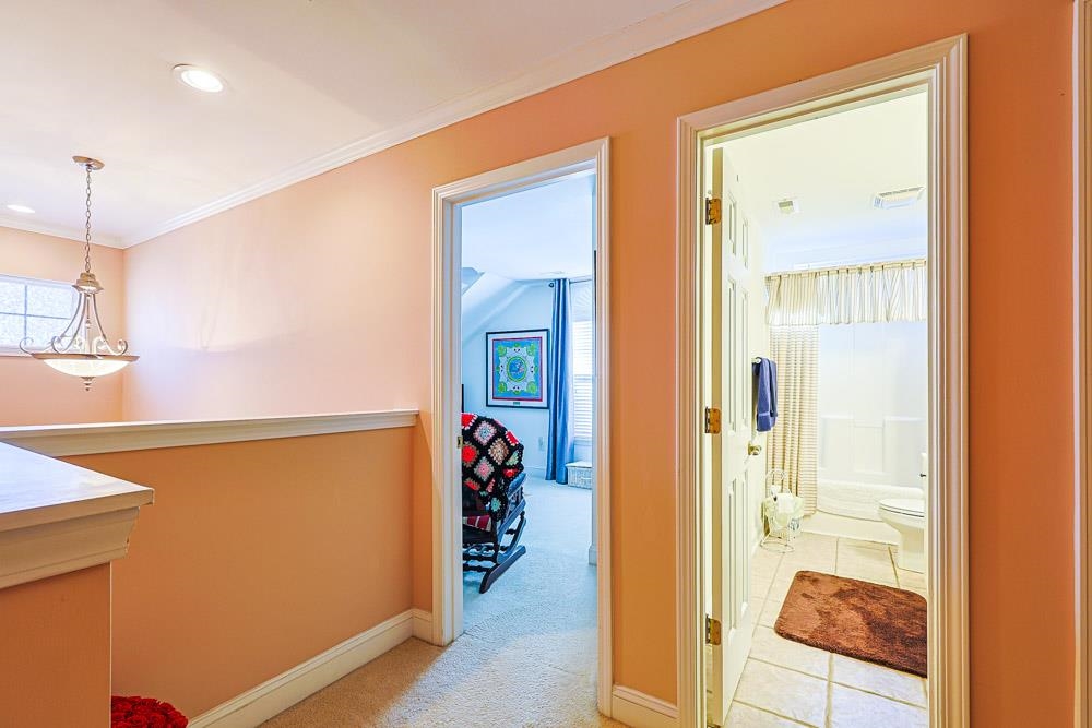 815 Botany Loop, Unit 815 Murrells Inlet, SC 29576 - Photo 24 of 40 Hall with ornamental molding, recessed lighting, and light colored carpet
