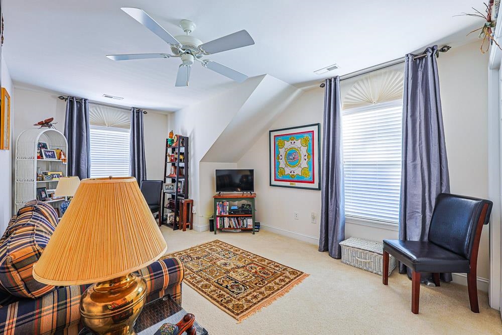 815 Botany Loop, Unit 815 Murrells Inlet, SC 29576 - Photo 25 of 40 Living room featuring carpet floors and ceiling fan