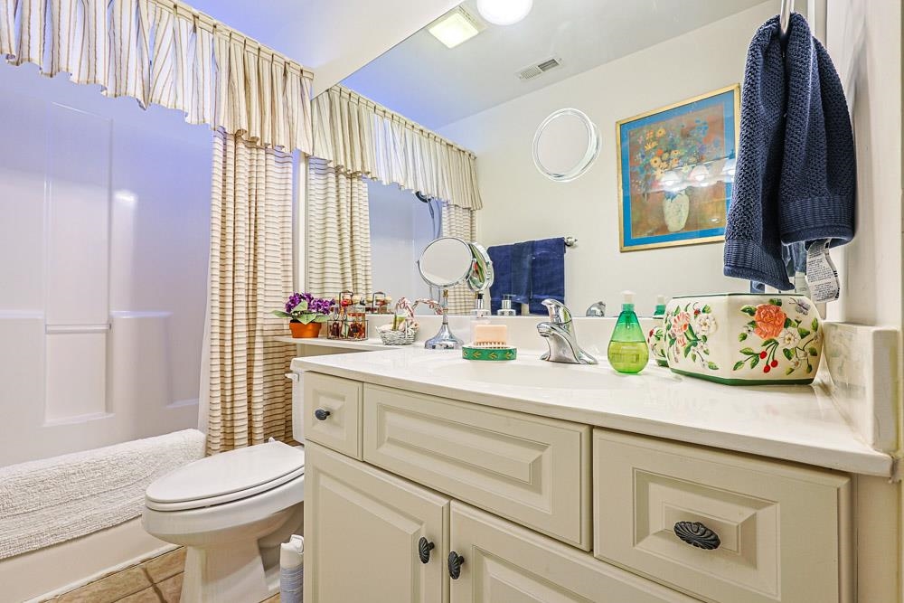 815 Botany Loop, Unit 815 Murrells Inlet, SC 29576 - Photo 27 of 40 Full bathroom featuring vanity, light tile patterned floors, and shower / bath combination with curtain