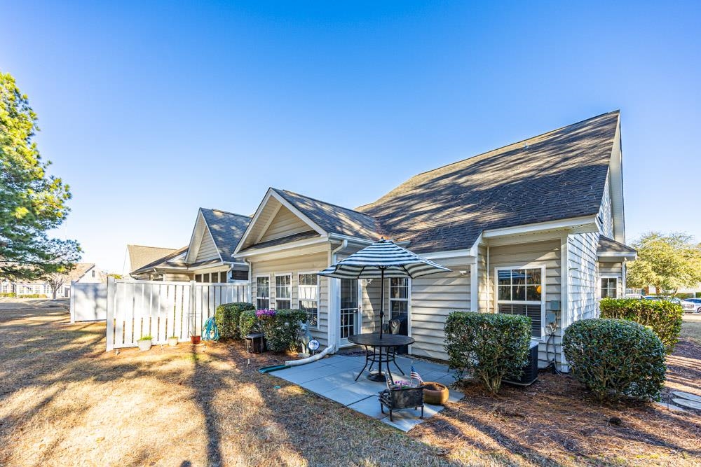 815 Botany Loop, Unit 815 Murrells Inlet, SC 29576 - Photo 36 of 40 View of front facade featuring a patio area and a shingled roof