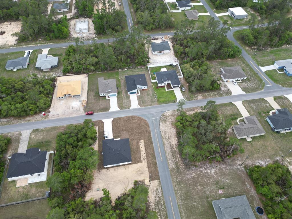 2644 Southwest 162nd Street Road Ocala, FL 34473 - Photo 8 of 47 an aerial view of a house with a yard and lake view