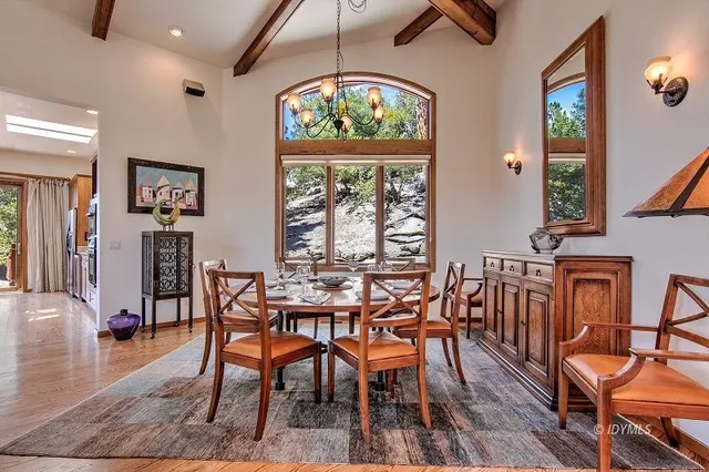 a bedroom with a large bed and a large window