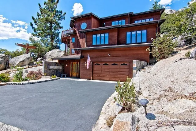 a front view of a house with a yard