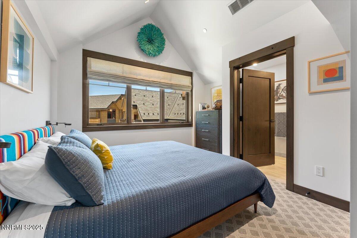 33 Beach Club Drive, Unit 506 Stateline, NV 89449 - Photo 14 of 44 a bedroom with a bed and a large window with outer view