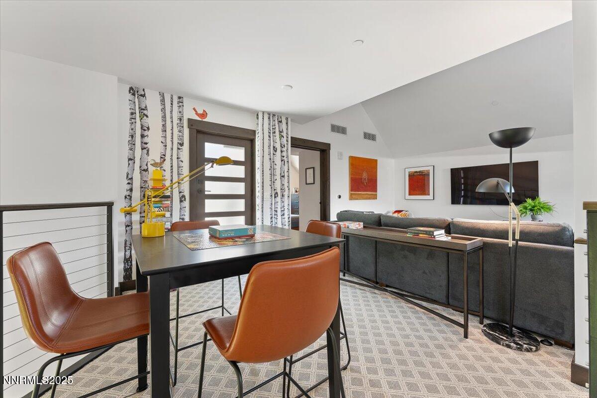 33 Beach Club Drive, Unit 506 Stateline, NV 89449 - Photo 18 of 44 a kitchen with granite countertop a sink and chairs