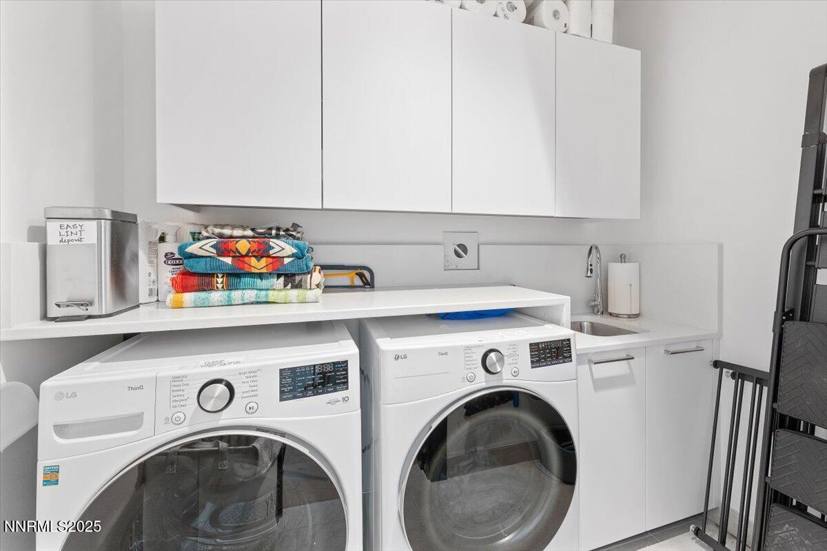 33 Beach Club Drive, Unit 506 Stateline, NV 89449 - Photo 22 of 44 a utility room with dryer and washer
