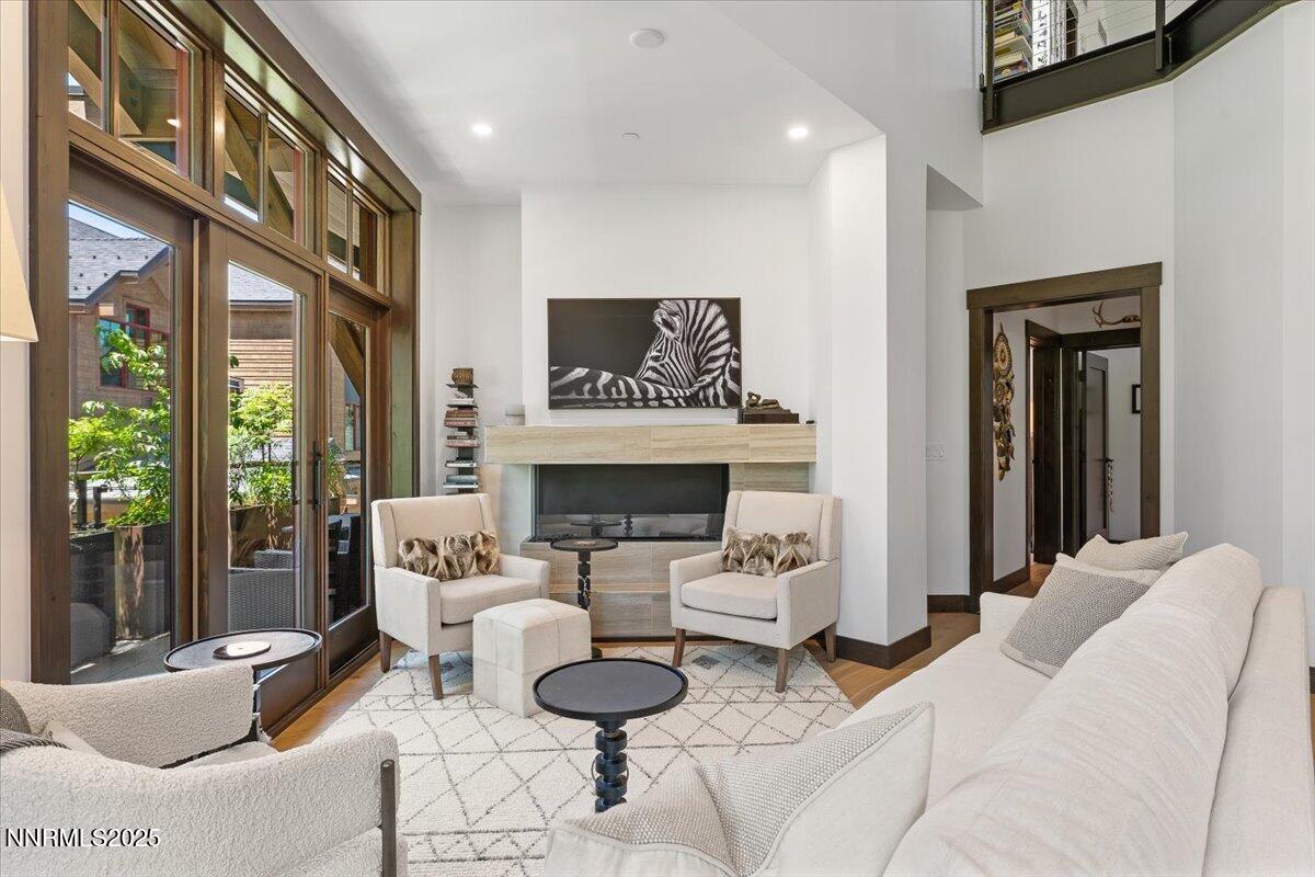 33 Beach Club Drive, Unit 506 Stateline, NV 89449 - Photo 5 of 44 a living room with furniture and a fireplace
