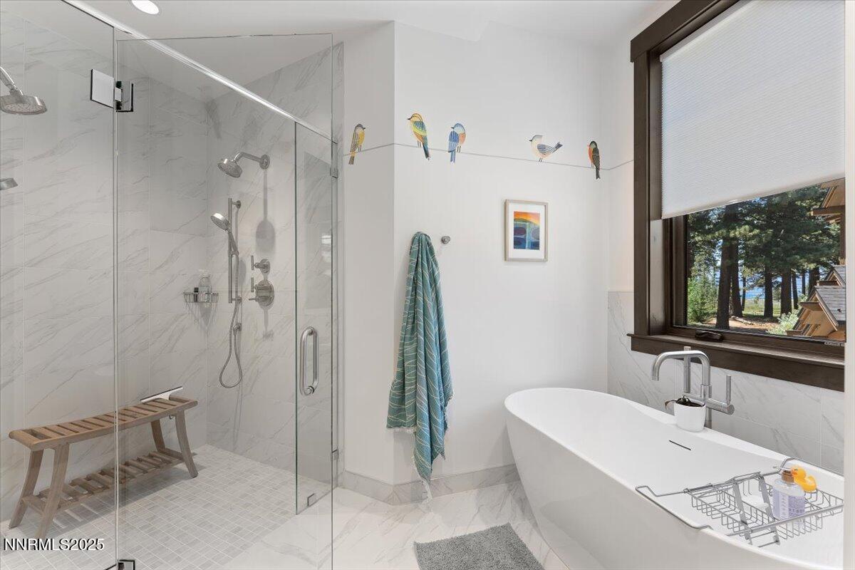 33 Beach Club Drive, Unit 506 Stateline, NV 89449 - Photo 9 of 44 a bathroom with a granite countertop sink a mirror and shower