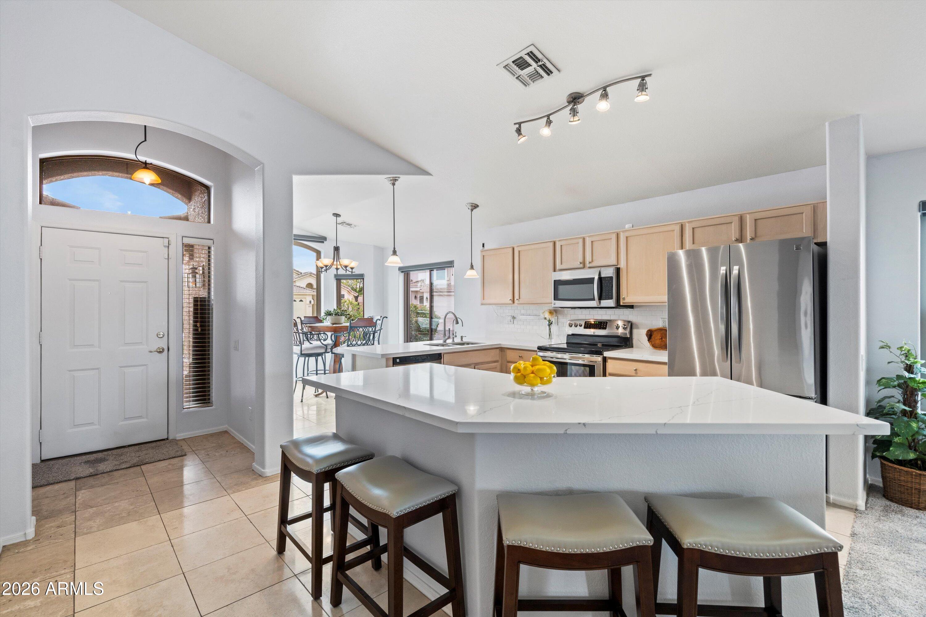 3022 East Captain Dreyfus Avenue Phoenix, AZ 85032 - Photo 3 of 28 Foyer to Kitchen