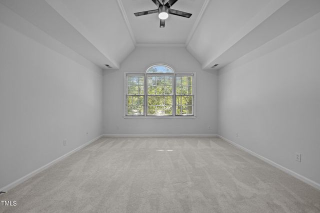 a bed room with a bed and a chair