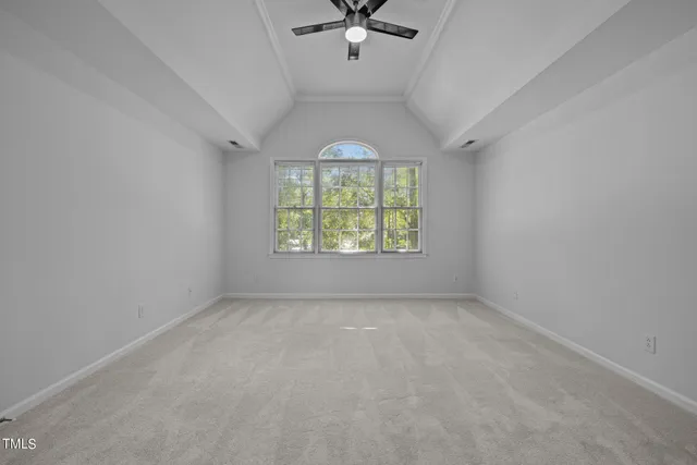 a bed room with a bed and a chair