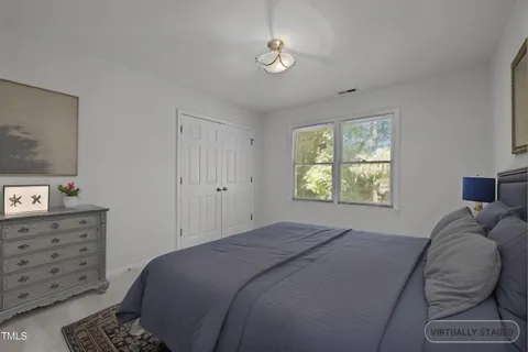 a view of deck with a large window and wooden floor