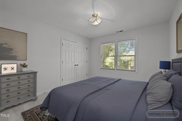 a view of deck with a large window and wooden floor