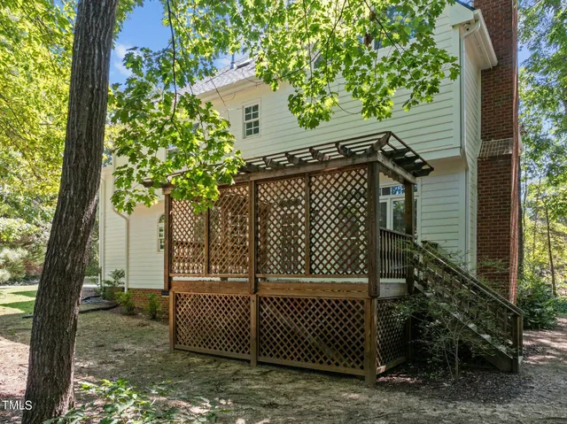 a view of a chair and table in the backyard