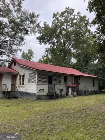 a front view of house with yard and seating area