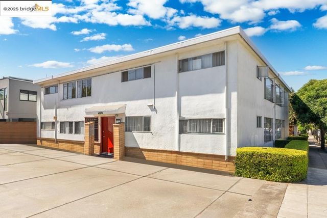 a view of a building with large trees