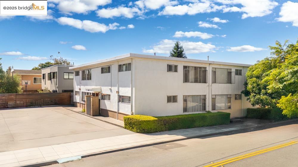 1728 Curtis Street Berkeley, CA 94702 - Photo 4 of 21 a front view of a house with a yard and garage