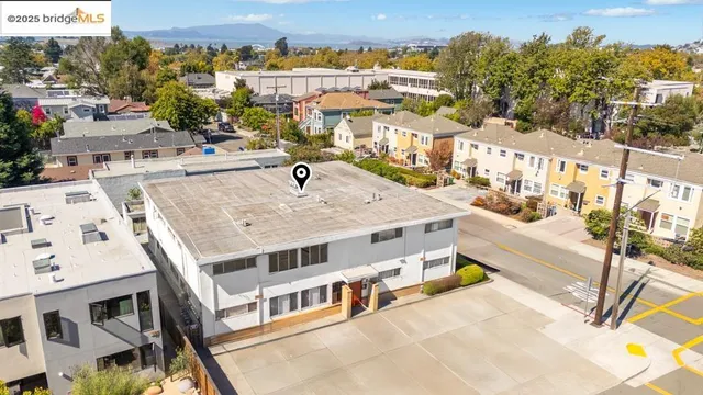 a view of a balcony with a table and chairs