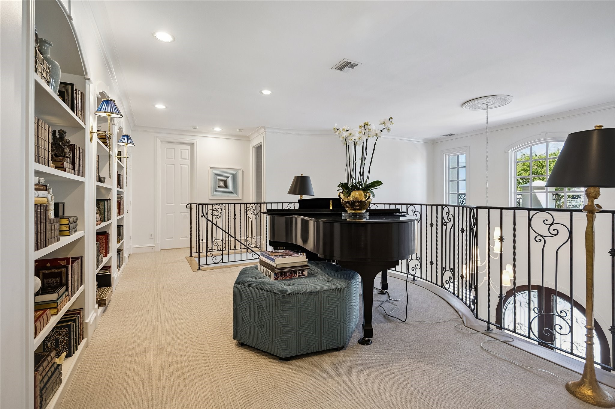 3 Exbury Way Houston, TX 77056 - Photo 19 of 41 a living room with furniture and a book shelf