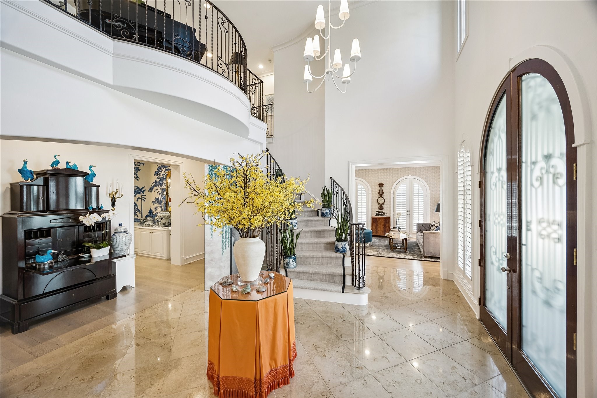 3 Exbury Way Houston, TX 77056 - Photo 2 of 41 a view of living room filled with furniture and a chandelier