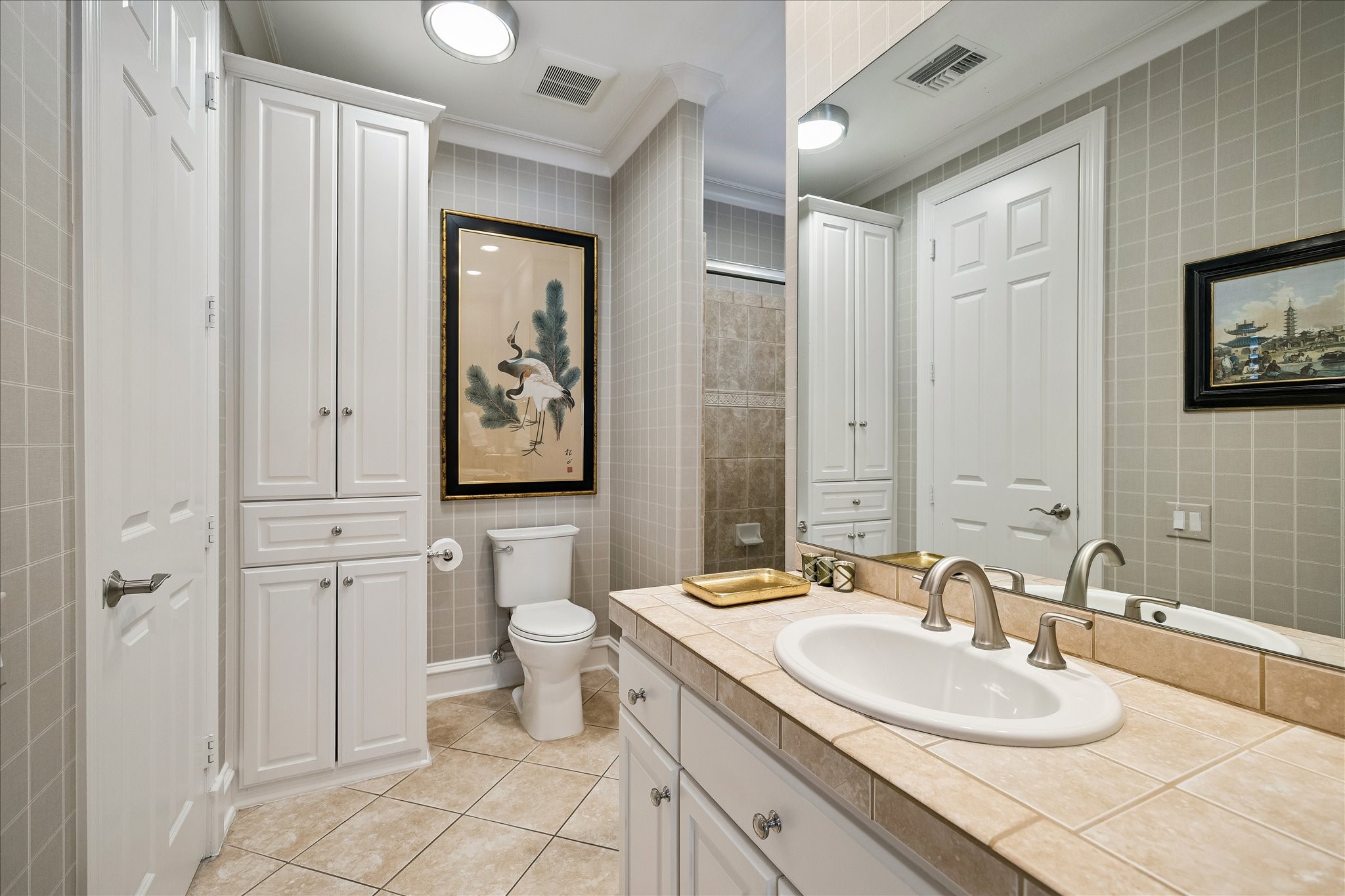 3 Exbury Way Houston, TX 77056 - Photo 26 of 41 a bathroom with a toilet sink and mirror