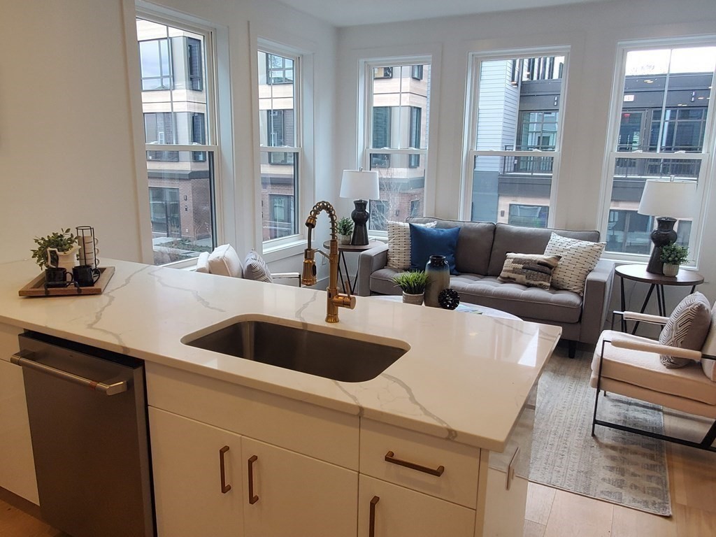 9 Greenmount Street, Unit 2 Boston, MA 02125 - Photo 2 of 15 a kitchen with a couch and a view of living room