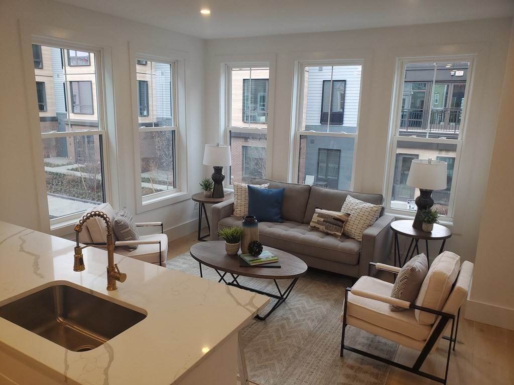 9 Greenmount Street, Unit 2 Boston, MA 02125 - Photo 3 of 15 a living room with furniture and windows