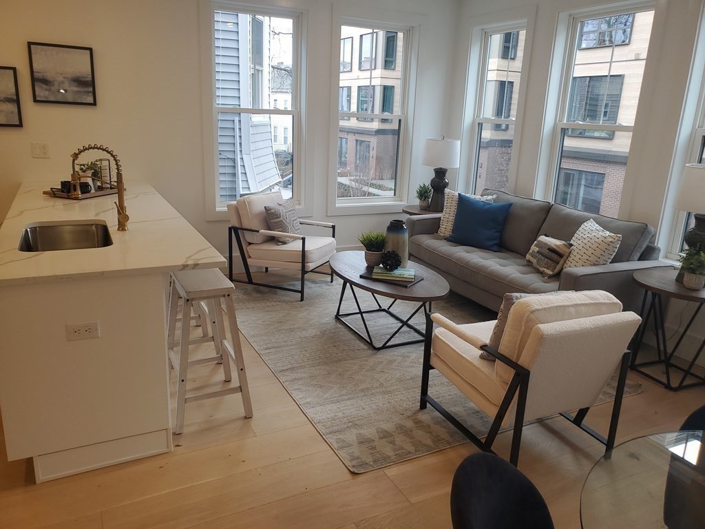 9 Greenmount Street, Unit 2 Boston, MA 02125 - Photo 4 of 15 a living room with furniture and a window