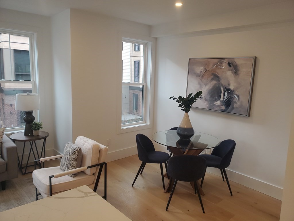 9 Greenmount Street, Unit 2 Boston, MA 02125 - Photo 5 of 15 a dining room with furniture and window