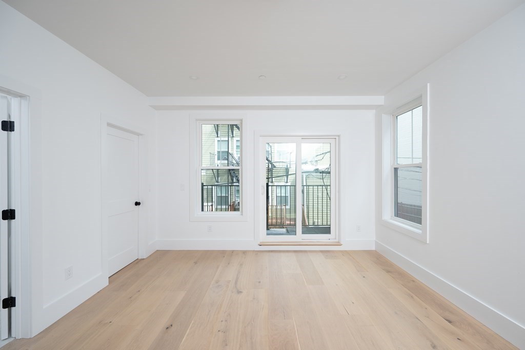 9 Greenmount Street, Unit 2 Boston, MA 02125 - Photo 8 of 15 an empty room with a window