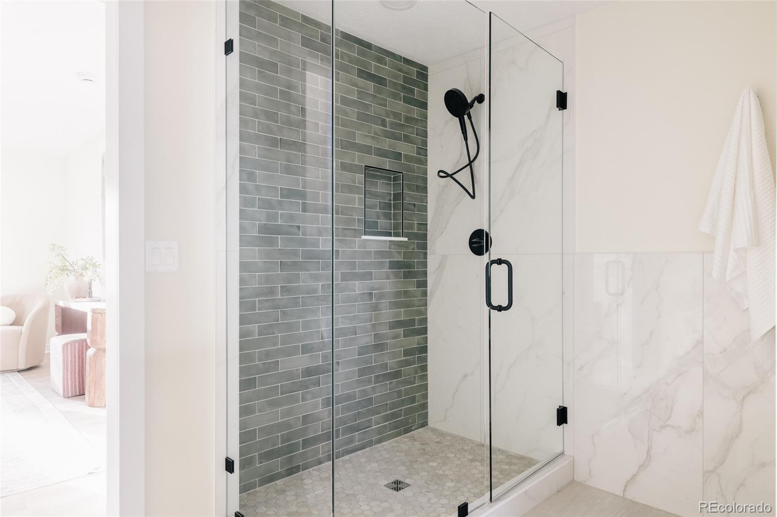 7580 South Lost Ranger Peak Littleton, CO 80127 - Photo 17 of 34 a bathroom with a shower