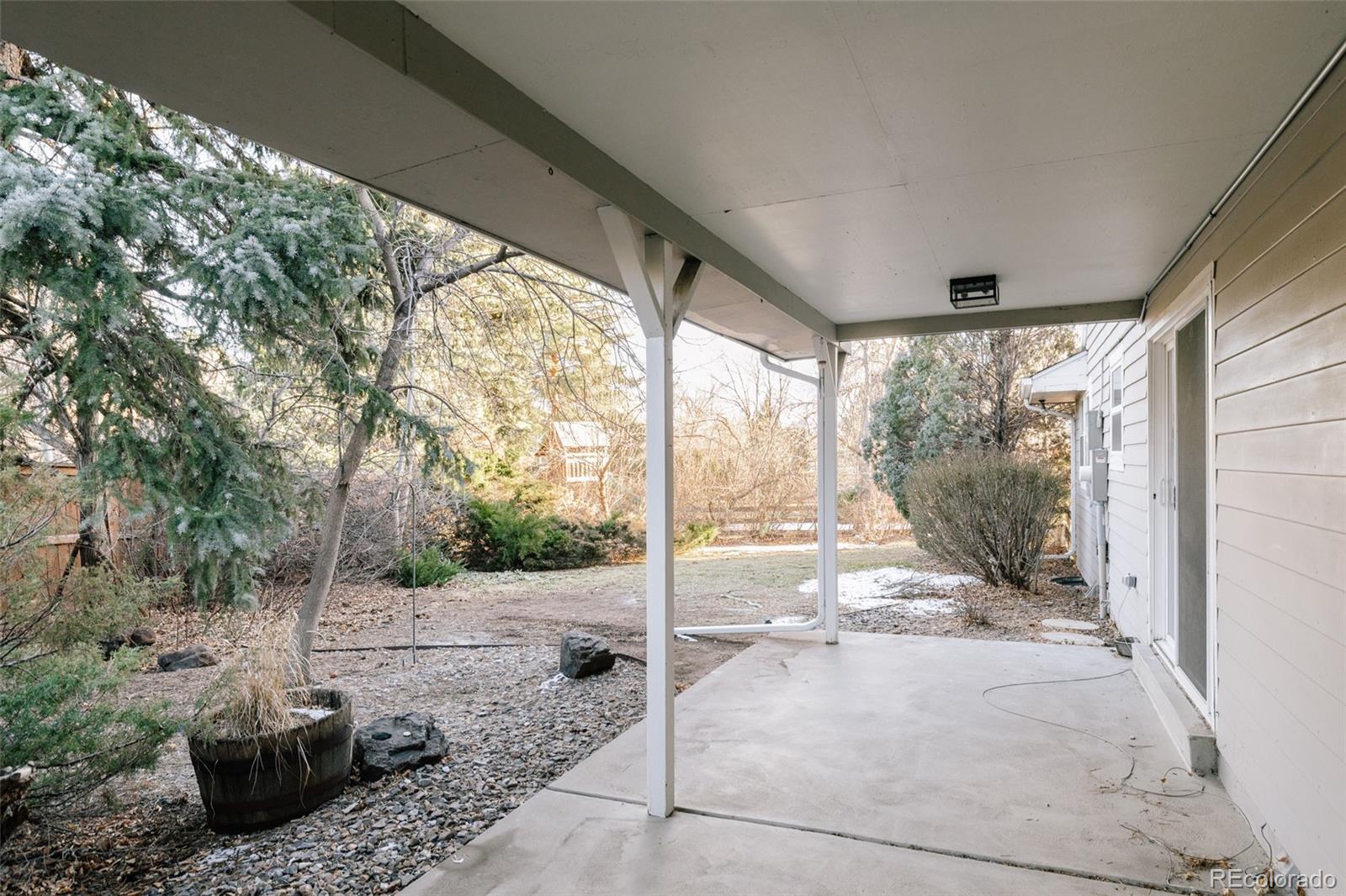 7580 South Lost Ranger Peak Littleton, CO 80127 - Photo 26 of 34 a view of a porch with furniture and garden