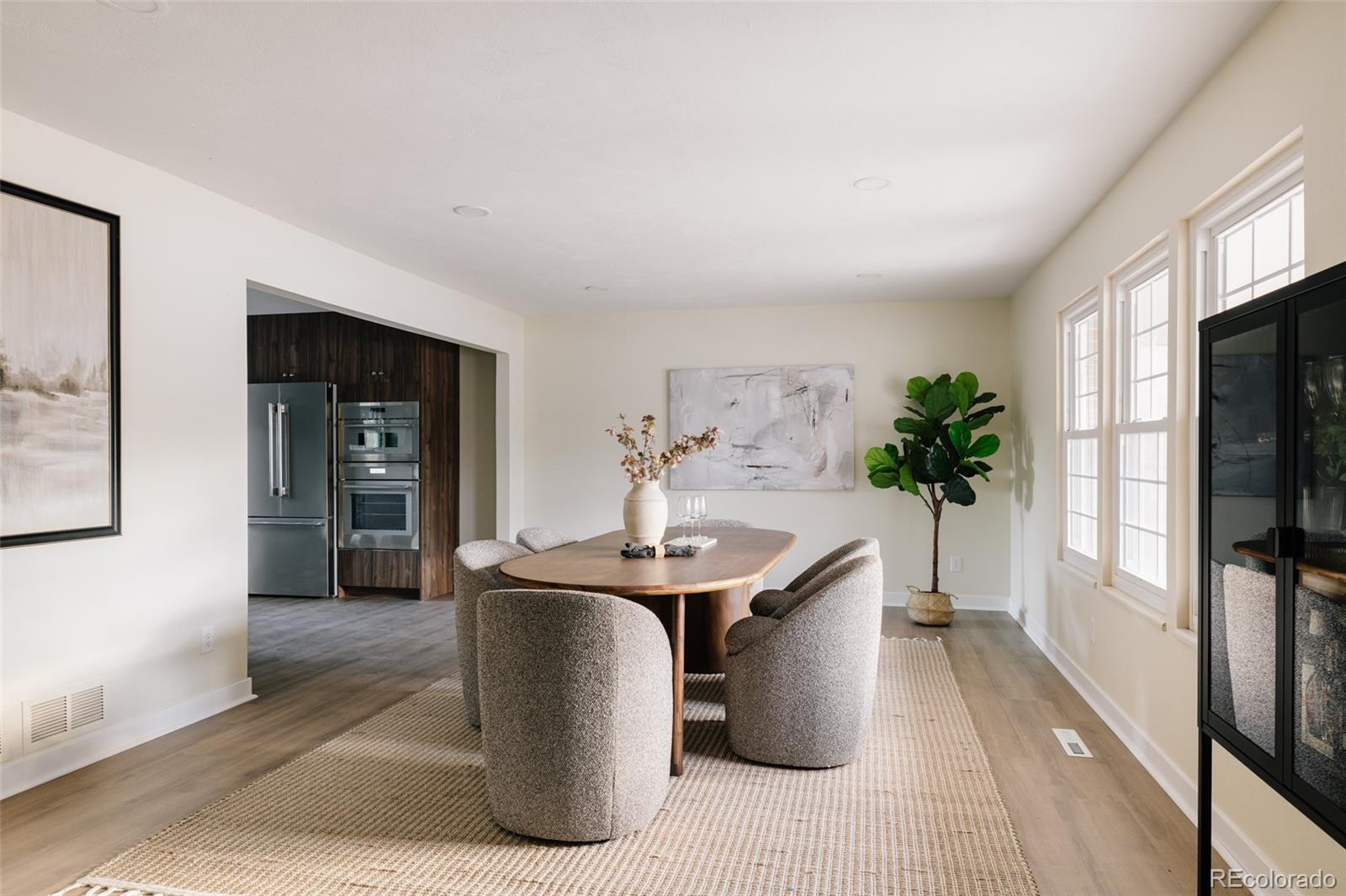 7580 South Lost Ranger Peak Littleton, CO 80127 - Photo 5 of 34 a dining room with furniture and potted plants