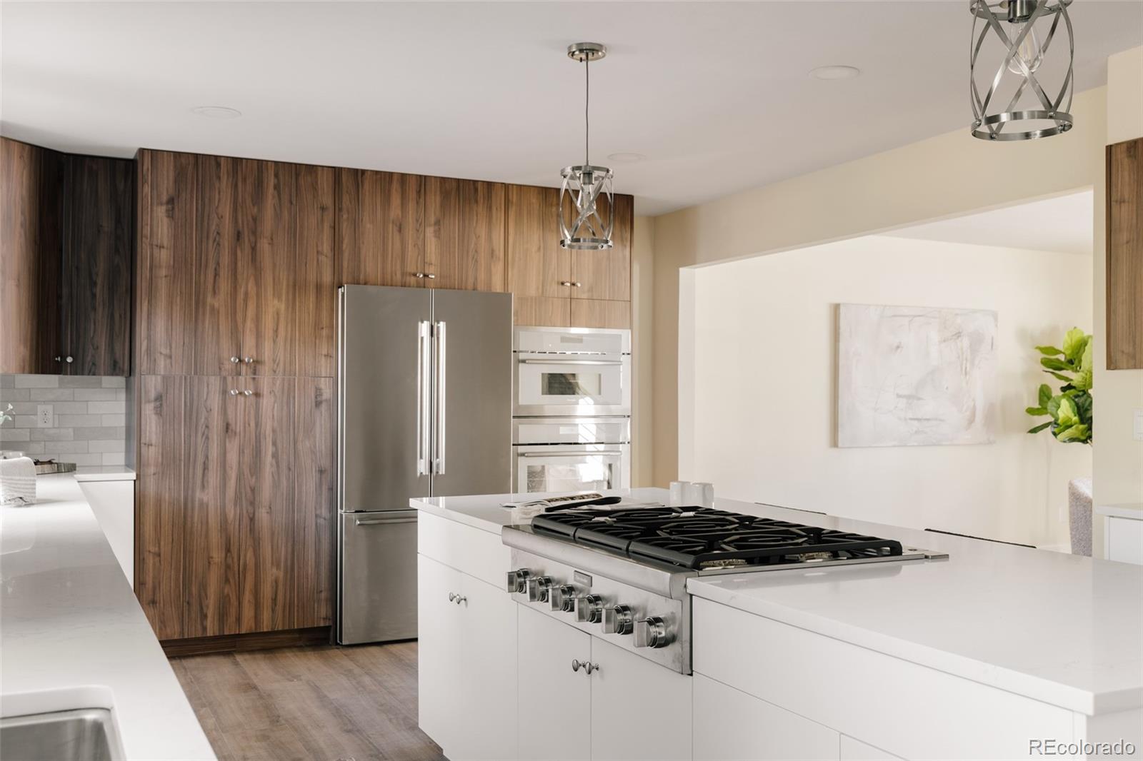 7580 South Lost Ranger Peak Littleton, CO 80127 - Photo 7 of 34 a kitchen with a stove and a refrigerator