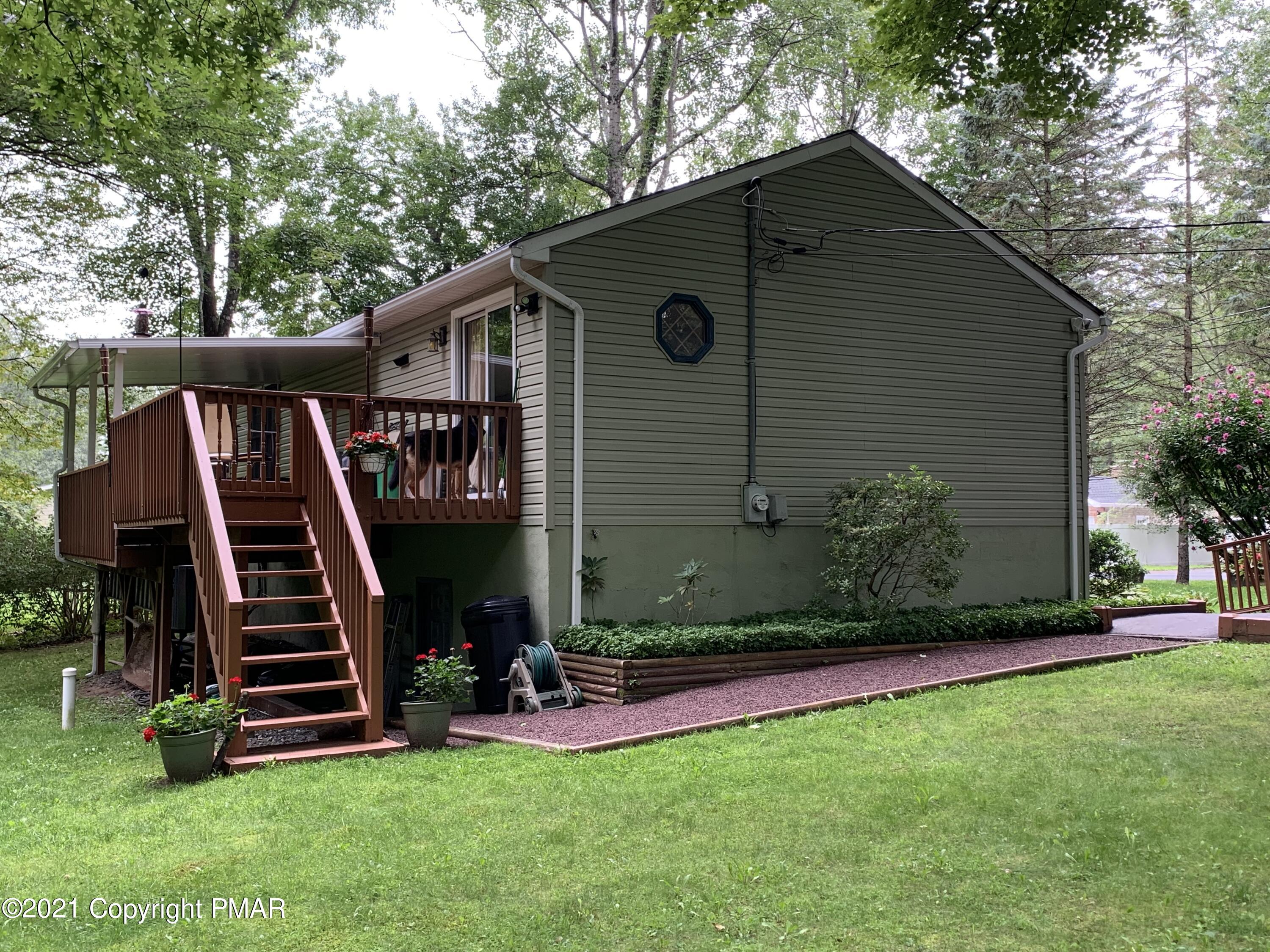338 Laurel Lake Road Bartonsville, PA 18321 - Photo 12 of 27 a view of a house with a yard and stairs