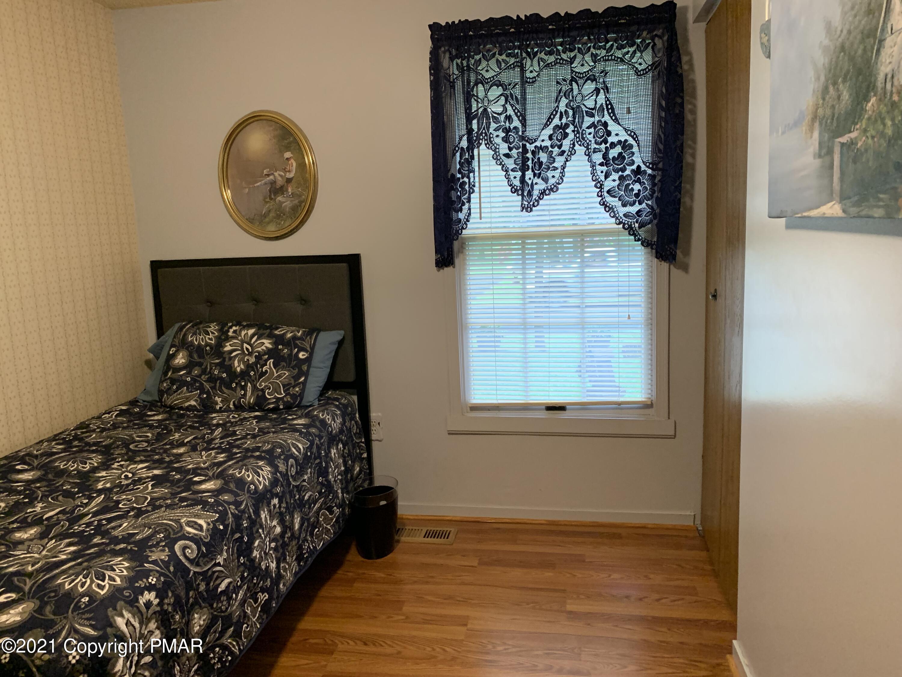 338 Laurel Lake Road Bartonsville, PA 18321 - Photo 22 of 27 a bed room with a bed and a window