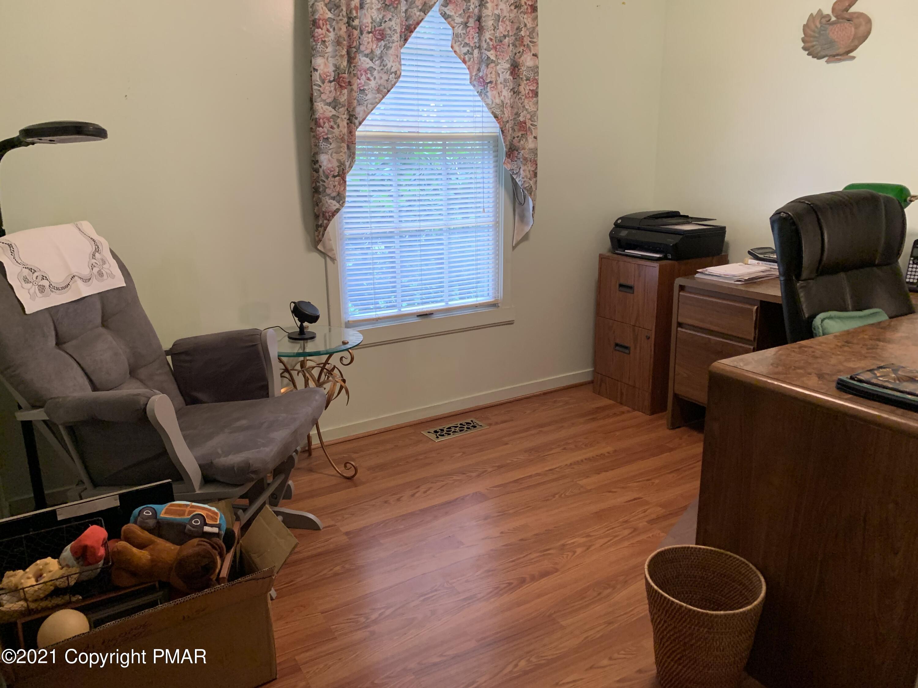338 Laurel Lake Road Bartonsville, PA 18321 - Photo 23 of 27 a room with furniture and a chair