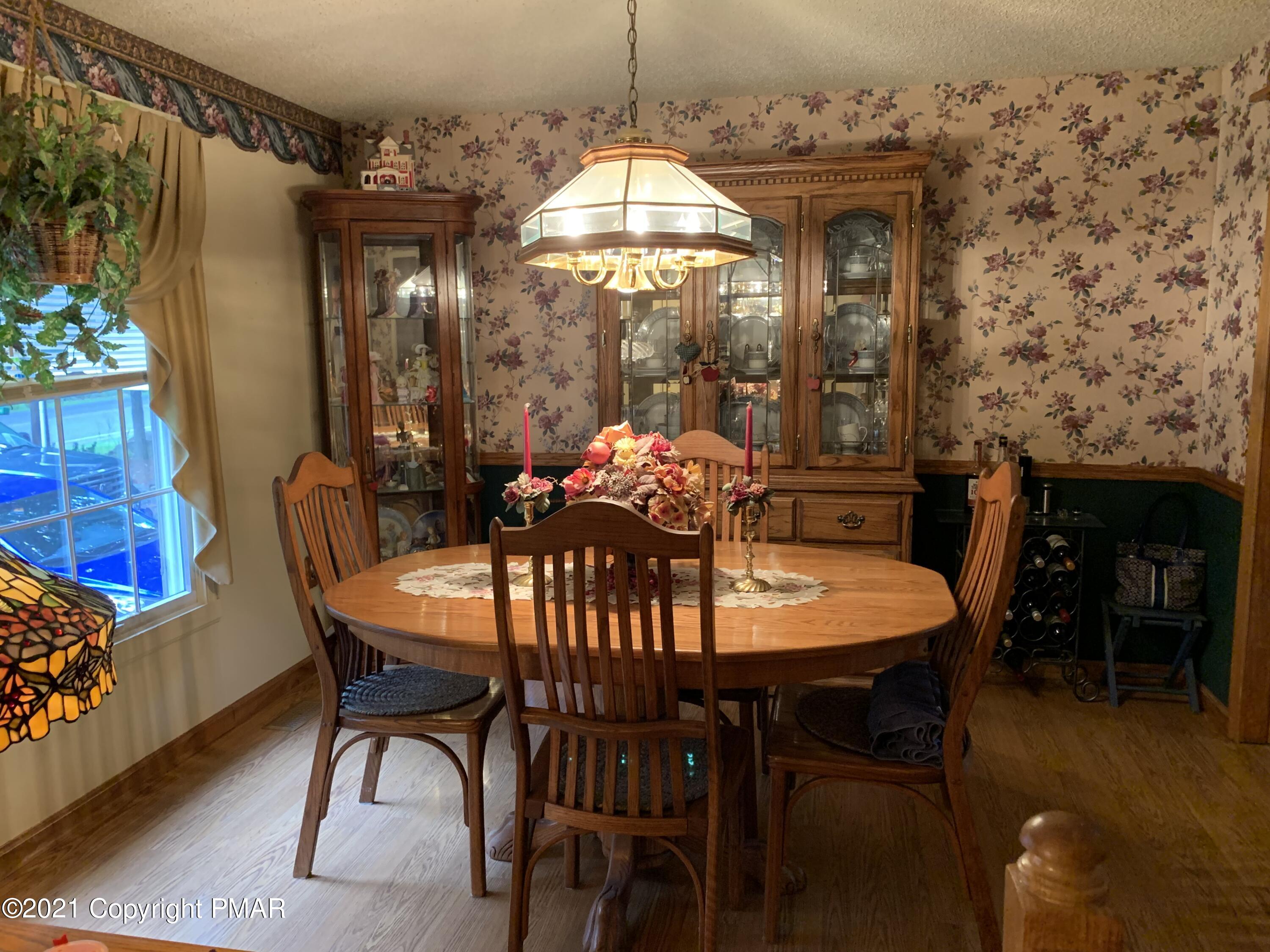 338 Laurel Lake Road Bartonsville, PA 18321 - Photo 4 of 27 a dining room with furniture and window