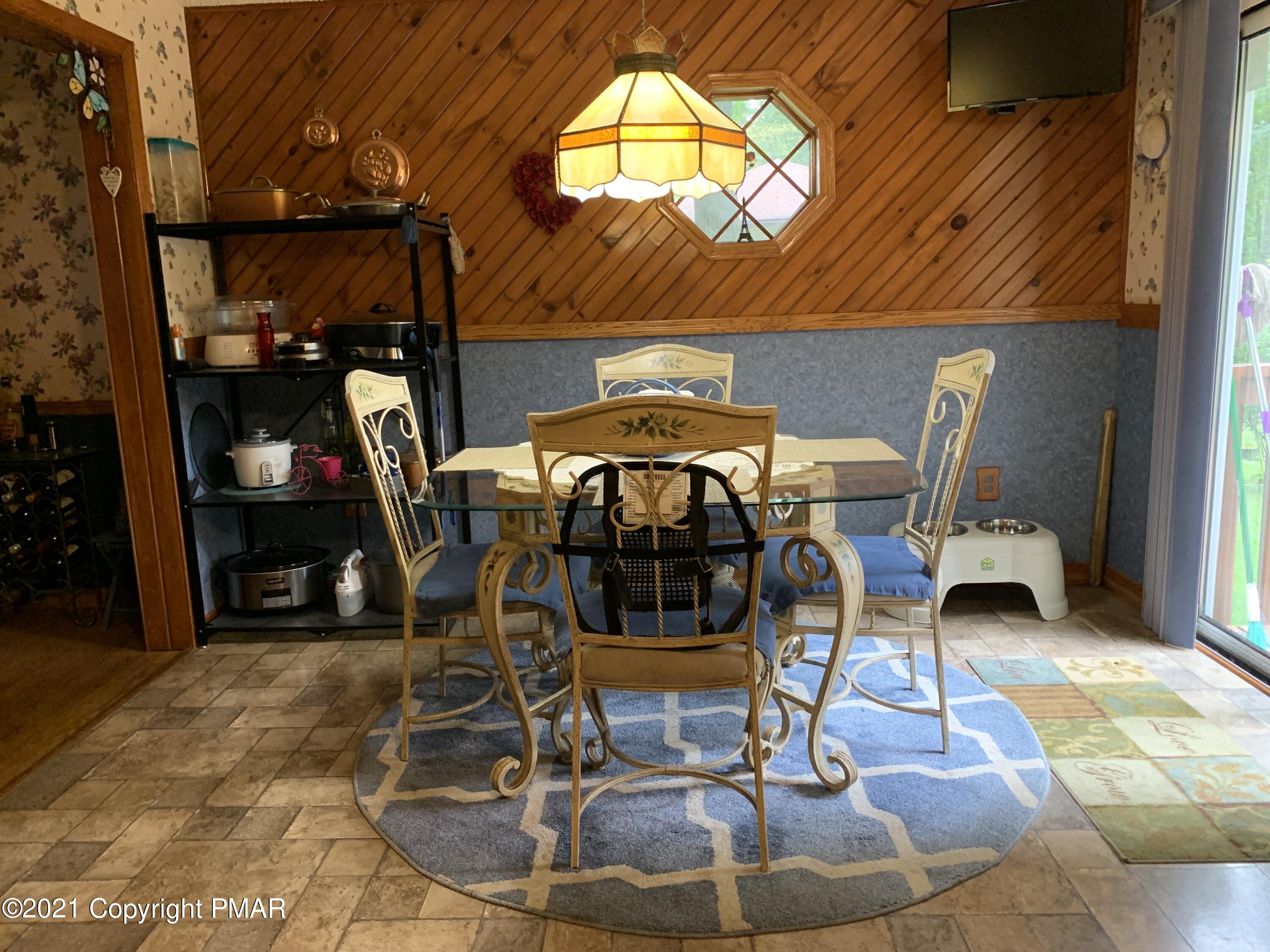 338 Laurel Lake Road Bartonsville, PA 18321 - Photo 6 of 27 a view of a chairs and tables in patio