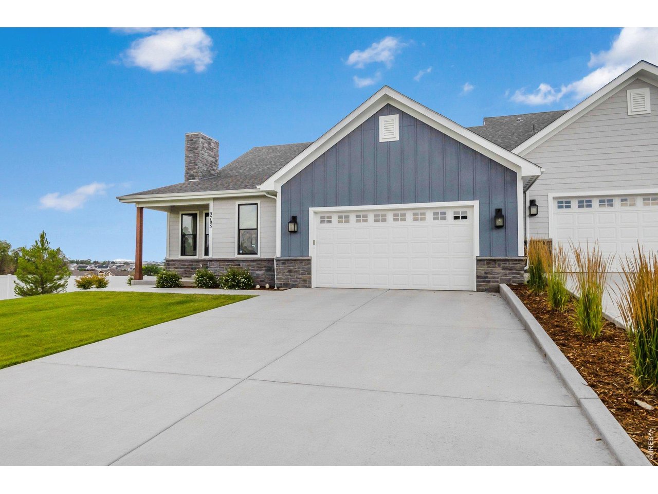 5705 2nd Road Greeley, CO 80634 - Photo 7 of 46 The oversized south facing garage is fully insulated, including the 8-foot overhead door. The deep driveway provides lots of room for added off street parking