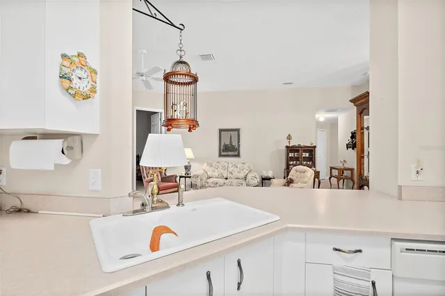 a kitchen that has a sink and a stove